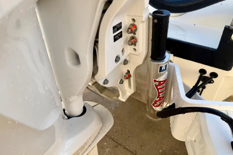 Slide: The Image of Close-up of 2025 Pathfinder 2300 HPS boat engine components and hydraulic system. - 4