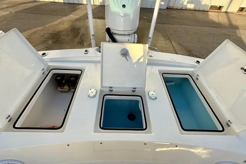 Slide: The Image of 2025 Pathfinder 2300 HPS boat storage compartments and livewell on deck. - 6