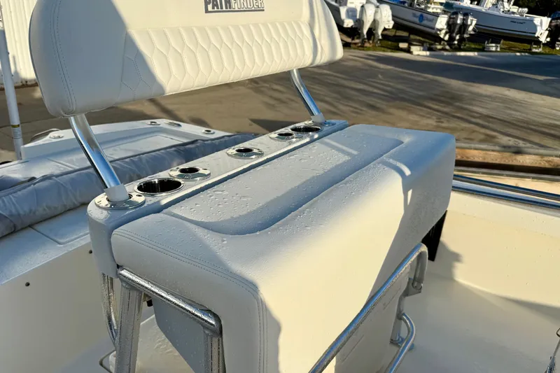 Slide: The Image of Pathfinder 2300 HPS 2025 boat seat with cup holders, wet from recent use. - 9