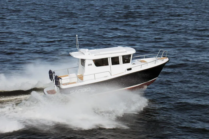 Slide: The Image of 2022 Sargo 25 boat speeding across the water. - 3