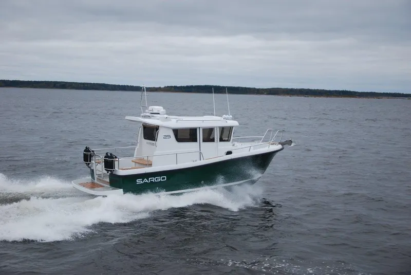Slide: The Image of 2022 Sargo 25 boat cruising on open water. - 4