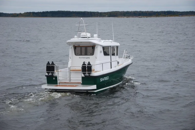 Slide: The Image of 2022 Sargo 25 boat cruising on open water. - 6