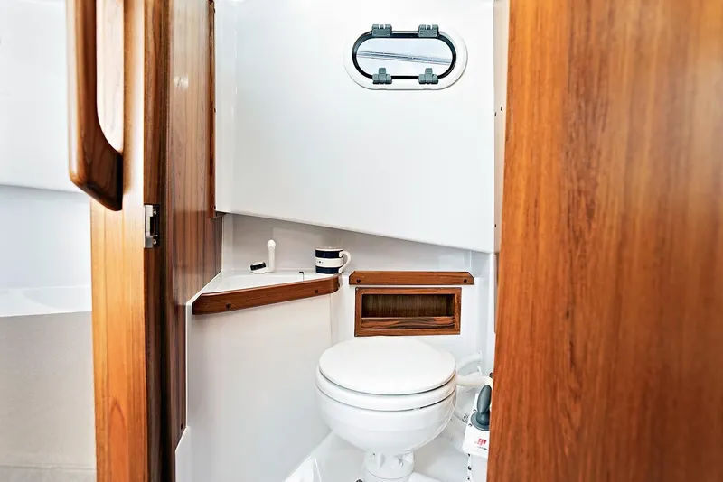 Slide: The Image of Interior of Sargo 25 yacht, bathroom with wood paneling, 2022 model. - 9