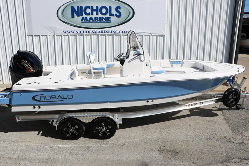 Slide: The Image of 2026 Robalo 226 Cayman boat on trailer at Nichols Marine dealership. - 10