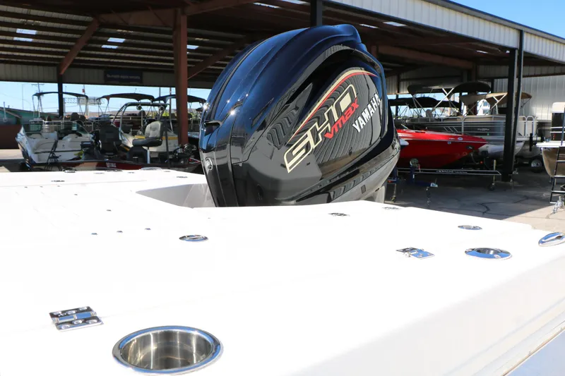 Slide: The Image of 2026 Robalo 226 Cayman with Yamaha SHO VMAX engine in a boat showroom. - 14