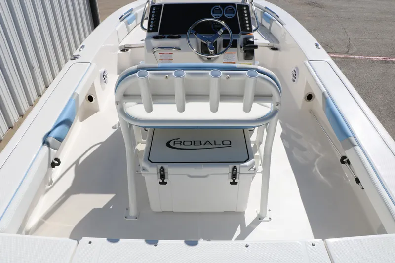 Slide: The Image of 2026 Robalo 226 Cayman boat interior with steering console and seating. - 19