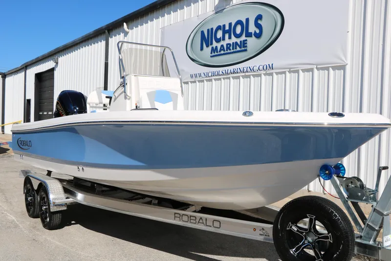 Slide: The Image of 2026 Robalo 226 Cayman boat on trailer at Nichols Marine dealership. - 3