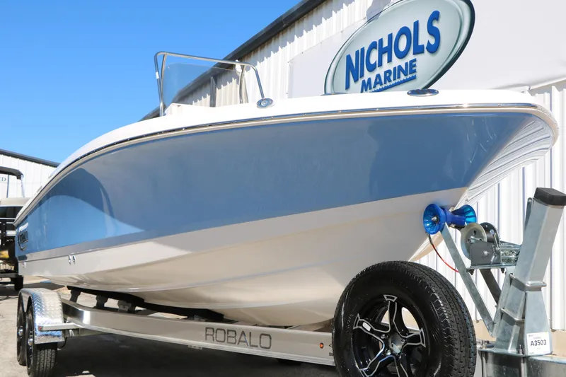 Slide: The Image of 2026 Robalo 226 Cayman boat on trailer at Nichols Marine dealership. - 4