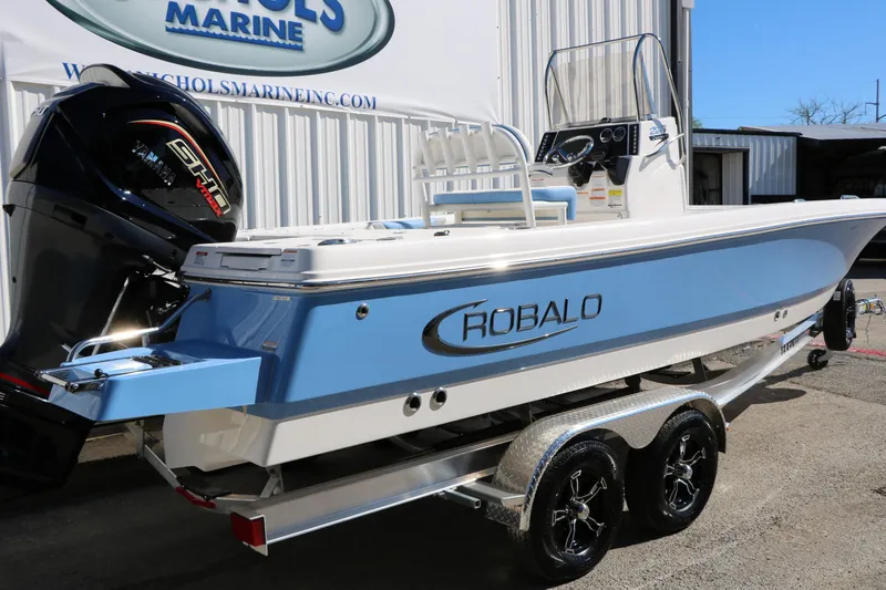 Slide: The Image of 2026 Robalo 226 Cayman boat on trailer, featuring sleek design and powerful engine. - 5