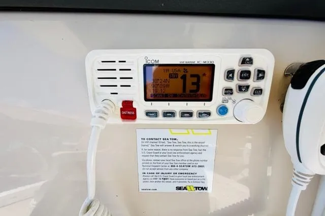 Slide: The Image of VHF marine radio on 2021 Boston Whaler 270 Dauntless boat dashboard. - 15