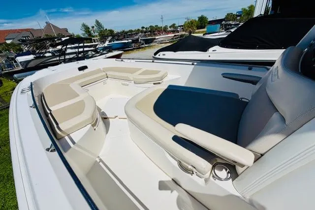 Slide: The Image of 2021 Boston Whaler 270 Dauntless boat interior with cushioned seating and armrests. - 17