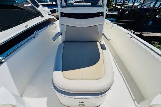 Slide: The Image of 2021 Boston Whaler 270 Dauntless boat interior with cushioned seating and sleek design. - 21
