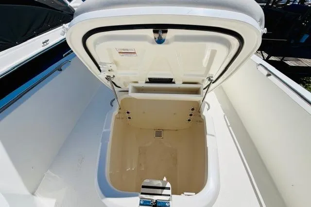 Slide: The Image of Open storage compartment on a 2021 Boston Whaler 270 Dauntless boat. - 24