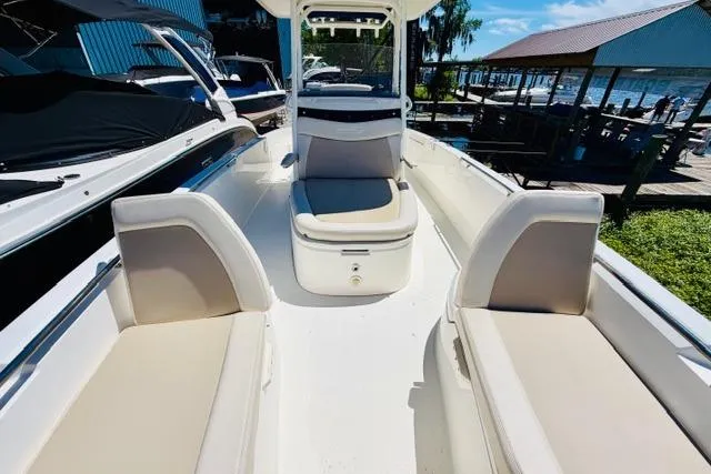 Slide: The Image of 2021 Boston Whaler 270 Dauntless boat interior with seating and console view. - 27