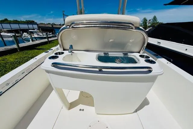 Slide: The Image of 2021 Boston Whaler 270 Dauntless boat interior with open storage compartment. - 8