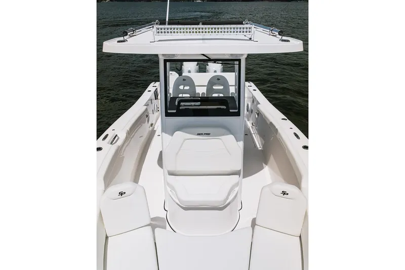 Slide: The Image of Manufacturer Provided Image: 2026 Sea Pro 265FLX Sandbar boat interior with seating and console on water. - 3