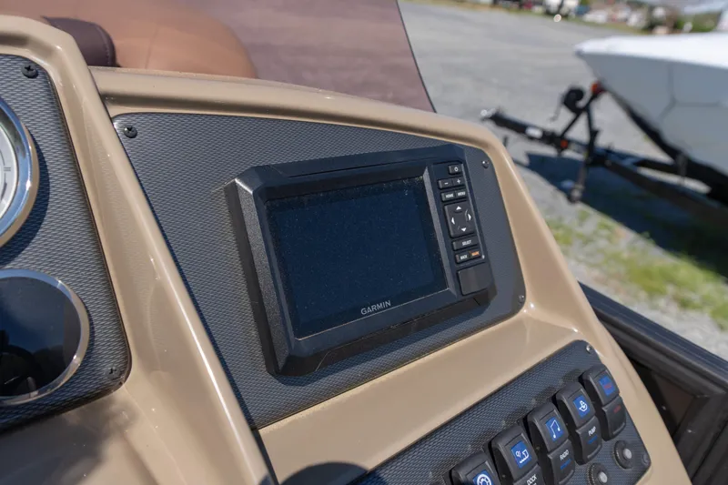 Slide: The Image of Dashboard of 2025 Starcraft EXS 3 boat with Garmin navigation system. - 11