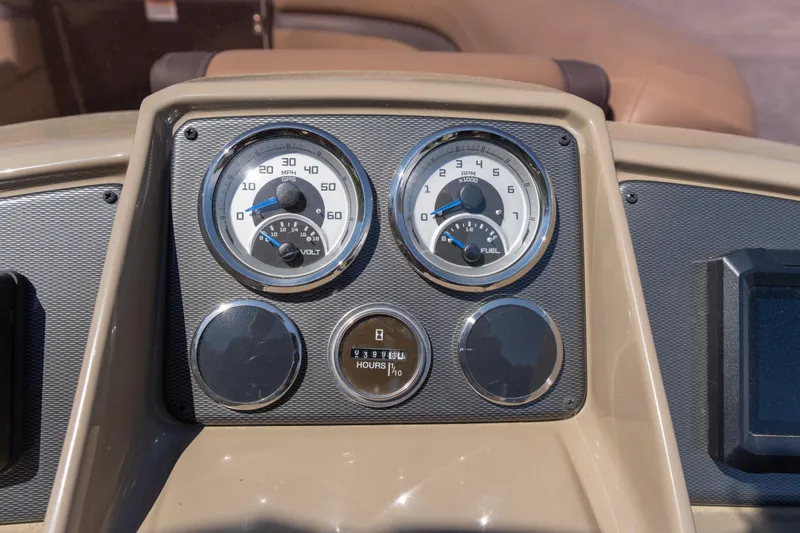 Slide: The Image of Dashboard of 2025 Starcraft EXS 3 boat with speedometer and fuel gauge. - 12