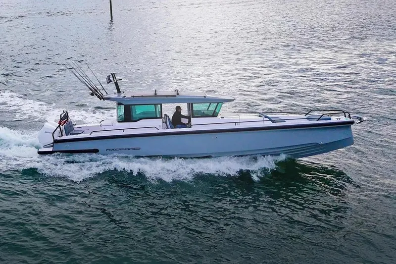 The Image of 2023 Axopar 37 XC Cross Cabin cruising on open water. - 0