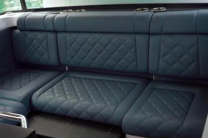 Slide: The Image of Luxurious blue seating in 2023 Axopar 37 XC Cross Cabin boat interior. - 13