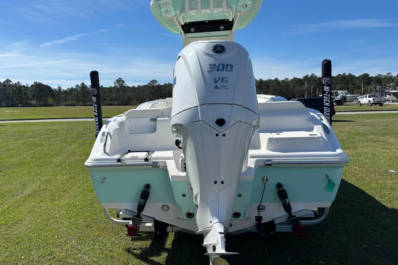 Slide: The Image of 2026 Key West 239 FS boat with Yamaha 300 V6 engine on grassy field. - 3