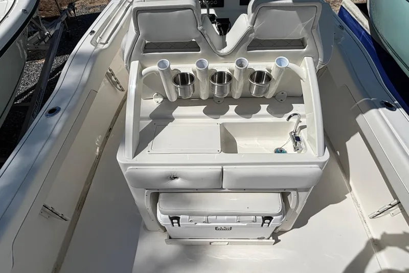 Slide: The Image of 2026 Key West 239 FS boat interior with seating and cup holders. - 4