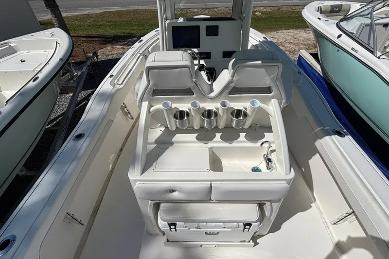 Slide: The Image of 2026 Key West 239 FS boat interior with seating and cup holders. - 5