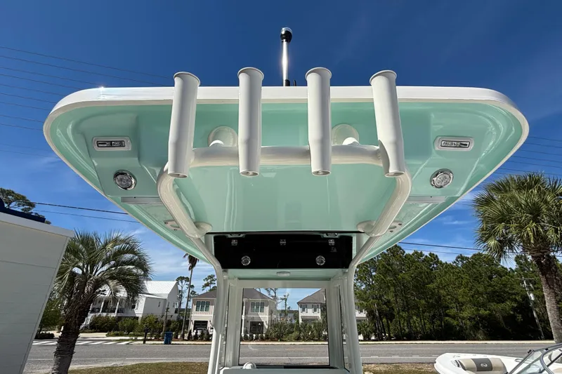 Slide: The Image of 2026 Key West 239 FS boat T-top with rod holders, under clear blue sky. - 6