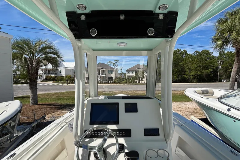 Slide: The Image of Interior view of 2026 Key West 239 FS boat with steering wheel and dashboard. - 7