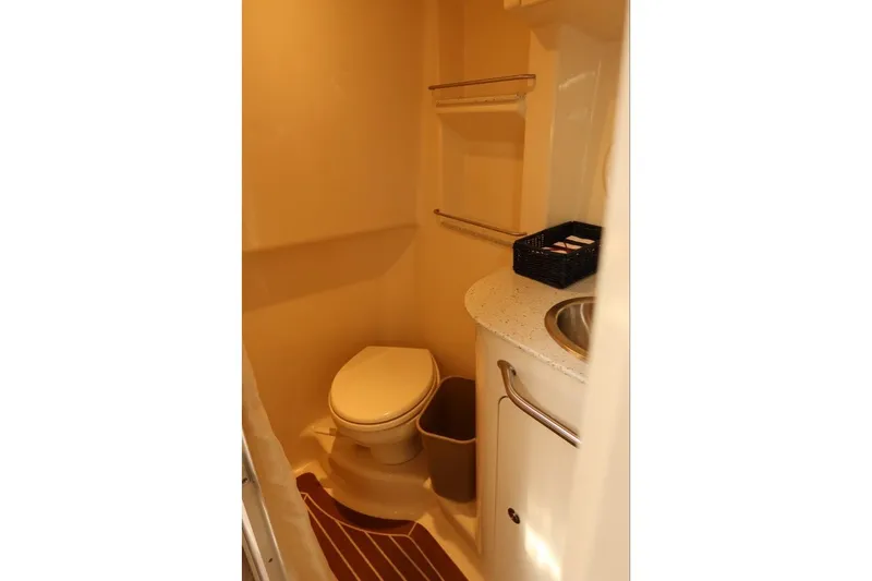 Slide: The Image of Bathroom interior of 2014 Sea Ray 330 Express Cruiser with toilet and sink. - 16