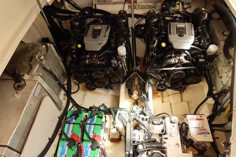 Slide: The Image of Engine room of 2014 Sea Ray 330 Express Cruiser with dual engines and batteries. - 4