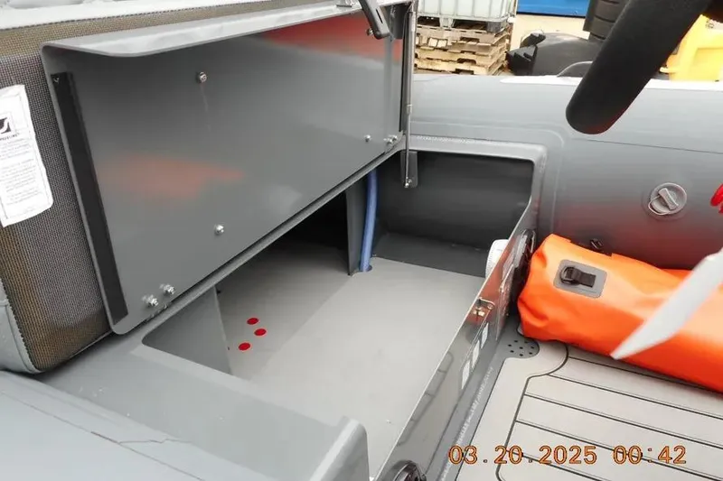 Slide: The Image of Open storage compartment in 2025 Highfield Sport 390 boat, showcasing interior space and design. - 7