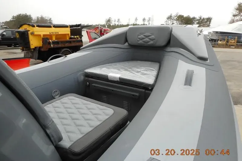 Slide: The Image of 2025 Highfield Sport 390 boat interior with cushioned seating and storage. - 9