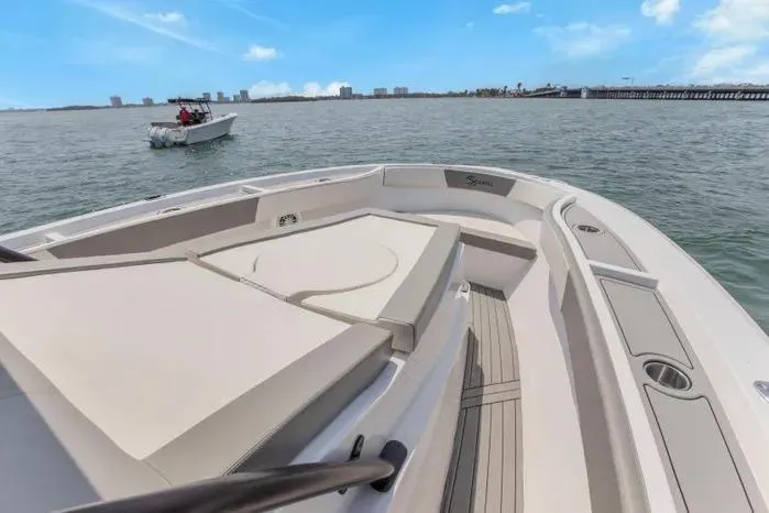 Slide: The Image of Luxurious 2026 SeaWell 345XL boat on calm waters with city skyline. - 13