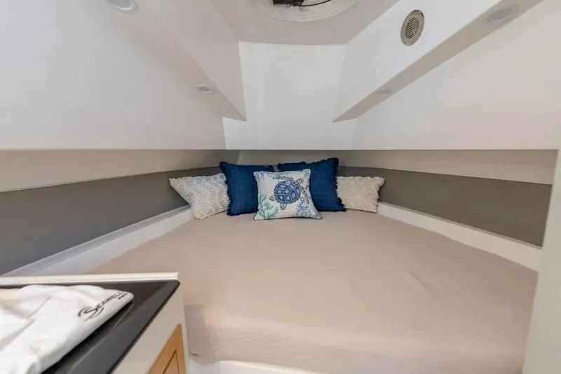 Slide: The Image of Cozy cabin interior of 2026 SeaWell 345XL boat with decorative pillows. - 15