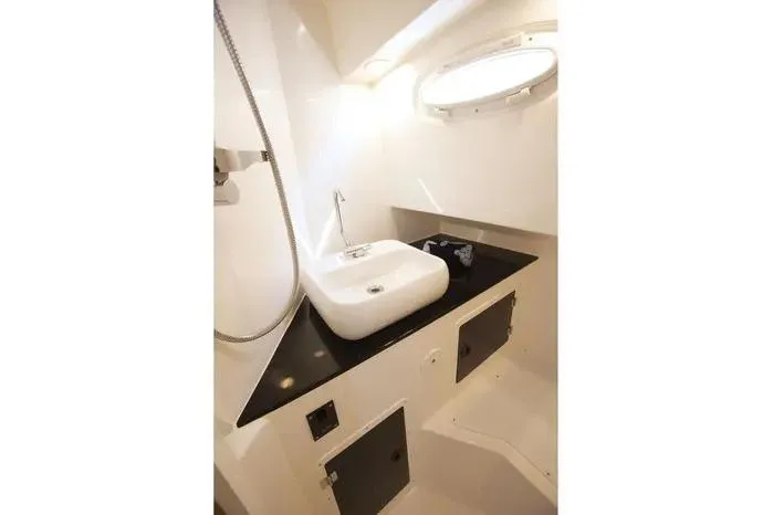 Slide: The Image of Modern bathroom interior of 2026 SeaWell 345XL yacht with sleek sink and porthole window. - 4