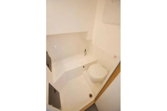 Slide: The Image of Compact bathroom in 2026 SeaWell 345XL boat, featuring a toilet and minimalist design. - 5