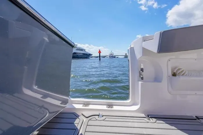 Slide: The Image of View from SeaWell 345XL boat, 2026 model, overlooking calm waters and distant yachts. - 9
