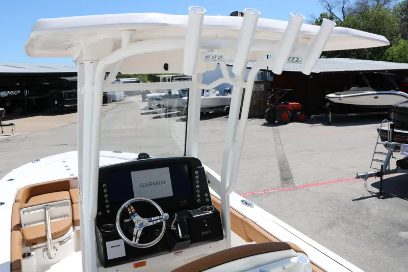 Slide: The Image of 2026 Robalo 246 Cayman boat console with Garmin display and steering wheel. - 18