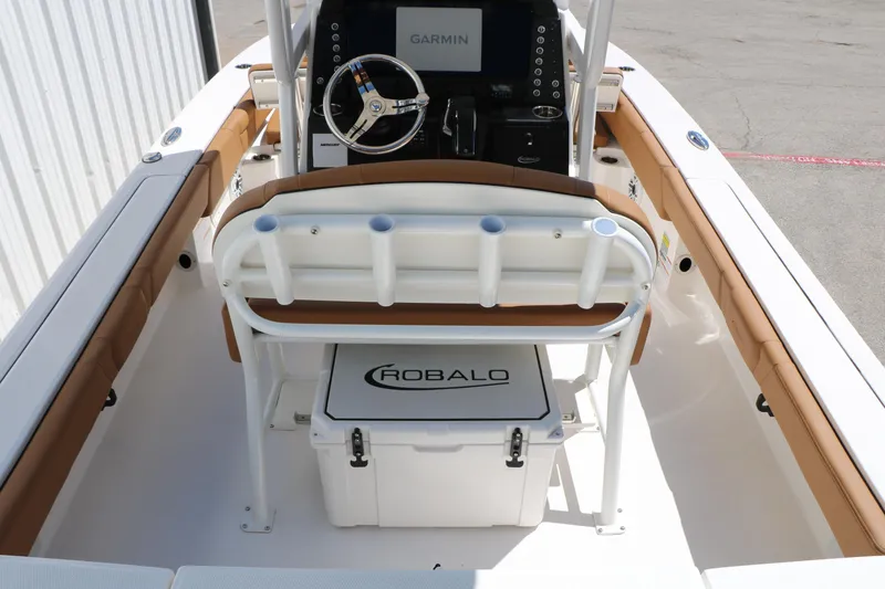 Slide: The Image of 2026 Robalo 246 Cayman boat interior with Garmin navigation and Robalo cooler. - 19