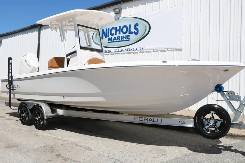 Slide: The Image of 2026 Robalo 246 Cayman boat on trailer at Nichols Marine dealership. - 2