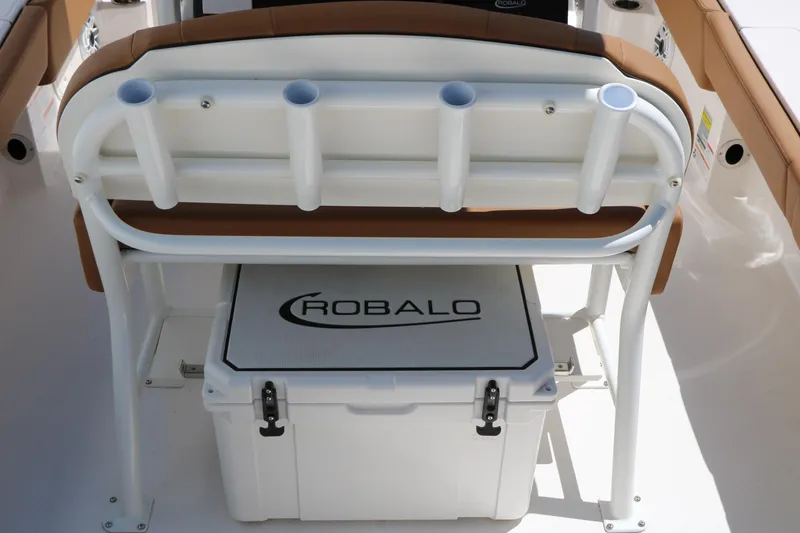 Slide: The Image of 2026 Robalo 246 Cayman boat interior with rod holders and cooler. - 20