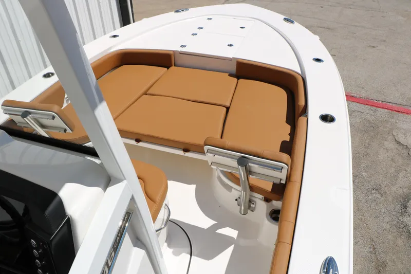 Slide: The Image of 2026 Robalo 246 Cayman boat with tan seating and sleek white deck design. - 21