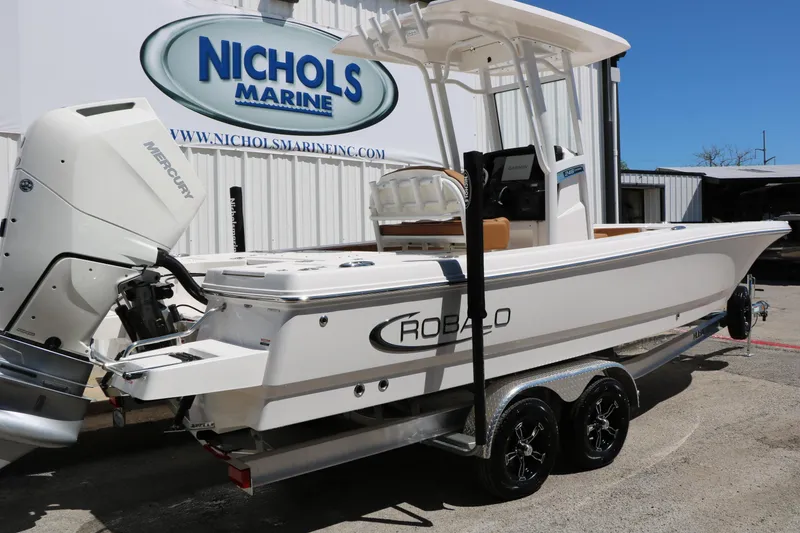 Slide: The Image of 2026 Robalo 246 Cayman boat at Nichols Marine dealership, featuring Mercury engine. - 4