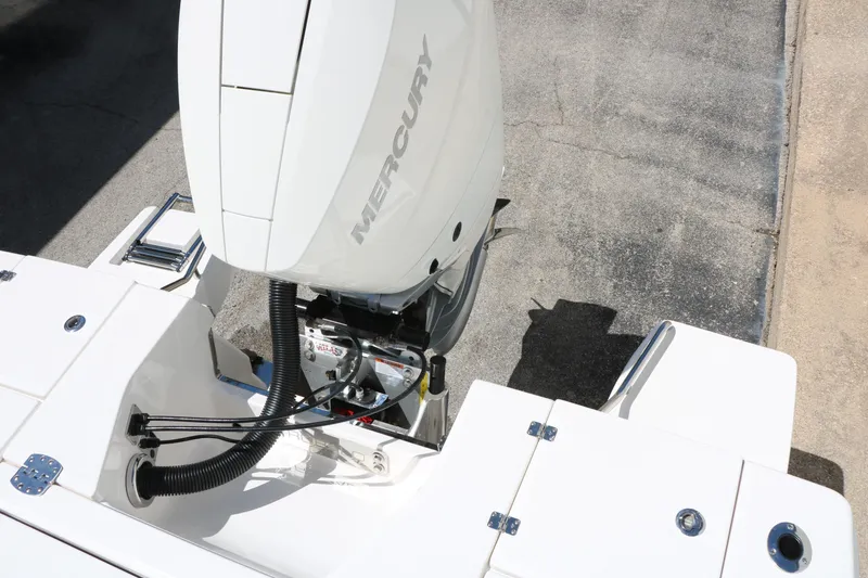 Slide: The Image of 2026 Robalo 246 Cayman boat with Mercury outboard engine, rear deck view. - 43