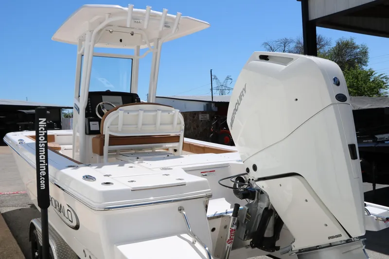 Slide: The Image of 2026 Robalo 246 Cayman boat with Mercury engine, docked at Nichols Marine. - 7