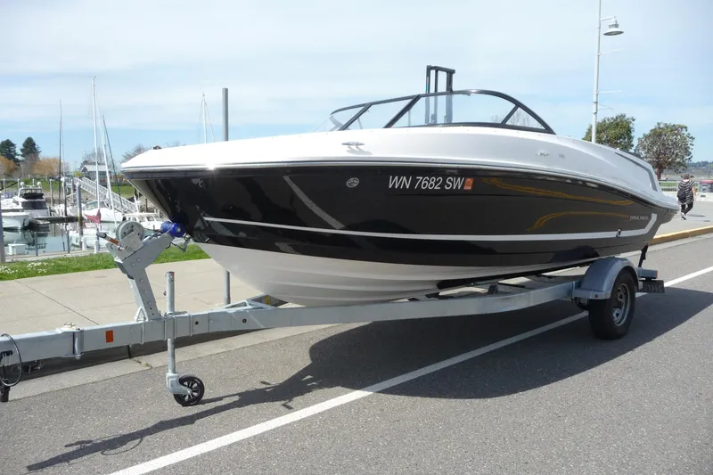 The Image of 2021 Bayliner VR5 Bowrider I/O on trailer, parked near marina. - 0