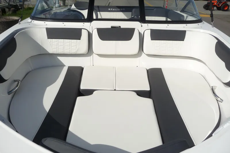 Slide: The Image of 2021 Bayliner VR5 Bowrider I/O interior with white and gray seating, showcasing spacious design. - 15