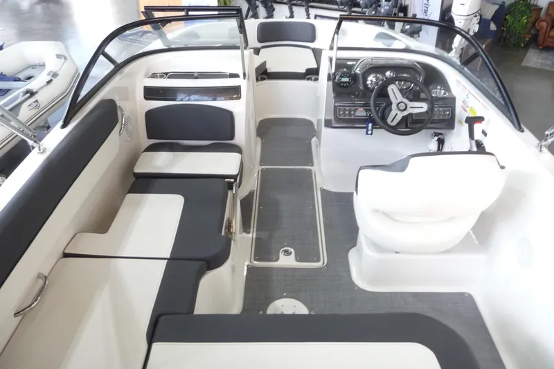 Slide: The Image of 2021 Bayliner VR5 Bowrider I/O interior with seating and steering console. - 19