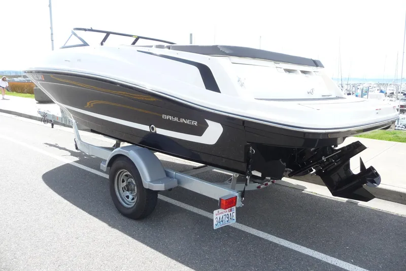 Slide: The Image of 2021 Bayliner VR5 Bowrider I/O on trailer, parked near marina. - 3